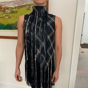 Tasselled high neck top.